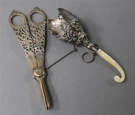 A pair of pierced silver grape scissors and a posy holder
